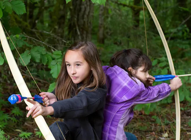 Kids practicing stealth and archery after school