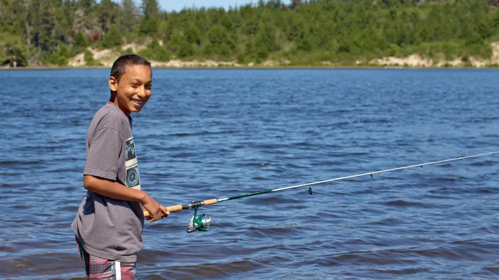 Camper fishing from the shore