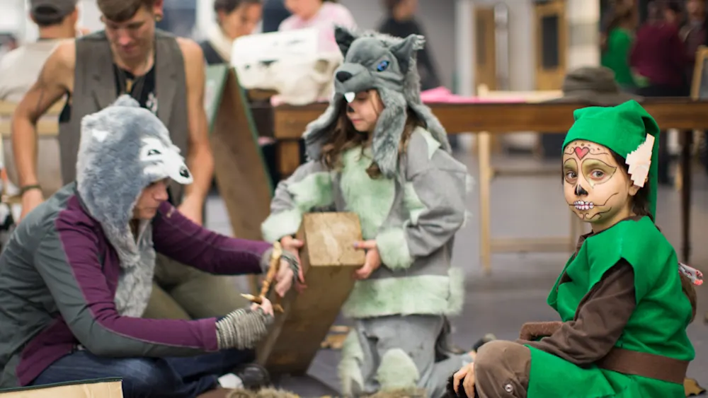 Kids in wolf costumes at a Trackers Halloween party